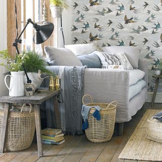 living room with grey sofa and storage basket