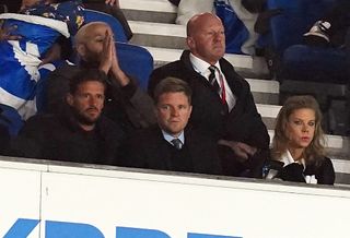 Former Bournemouth manager Eddie Howe (centre) was in the stands for Newcastle's match at Brighton