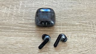 JBL Tune Flex: true wireless earbuds on a wooden table