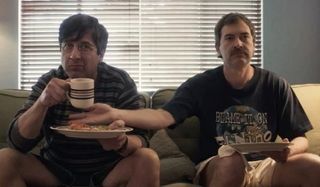Paddleton Ray Romano and Mark Duplass goofing off at breakfast on the couch