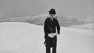 Charlie Chaplin standing in the snow in The Gold Rush