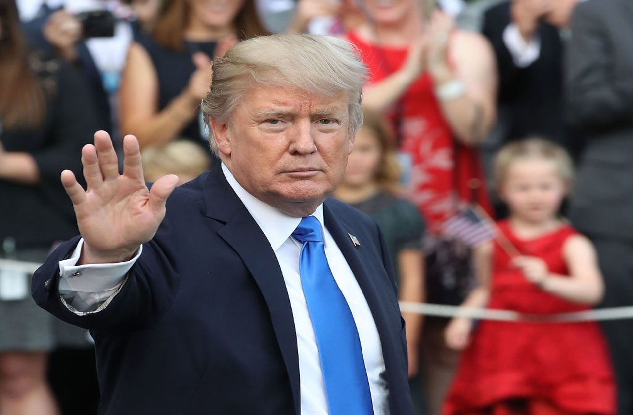 WASHINGTON, DC - JULY 12: U.S. President Donald Trump waves as he walks with his wife Melania to Marine One while departing from the White House on July 12, 2017 in Washington, DC. President 