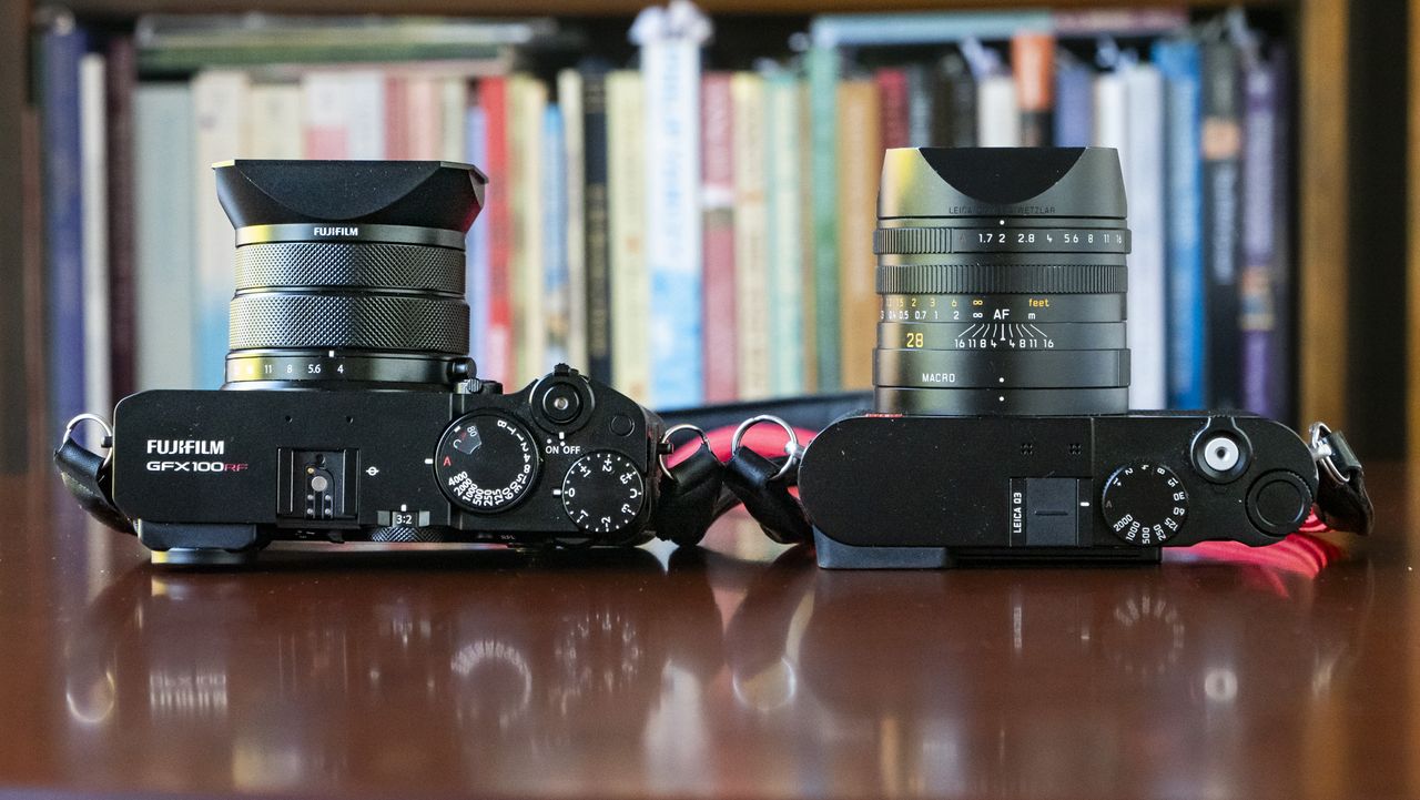 Fujifilm GFX100 RF alongside Leica Q3, view of each top plate