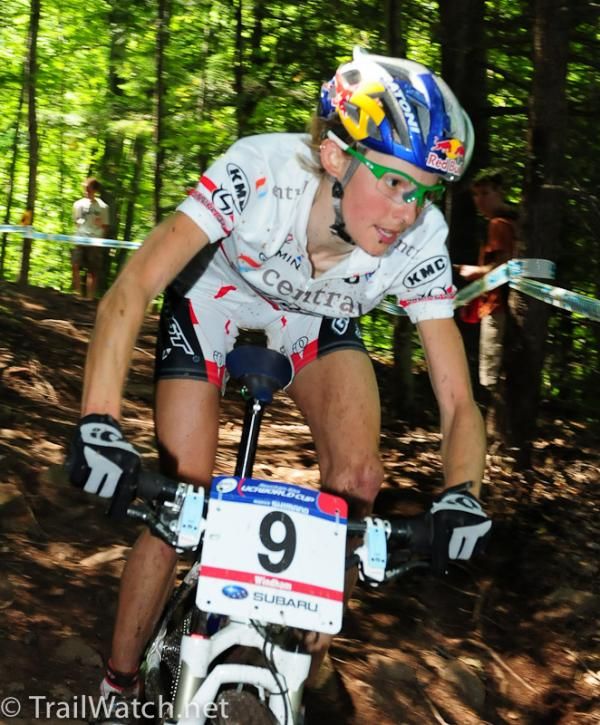 Elisabeth Osl (Central Ghost) riding some roots and rocks
