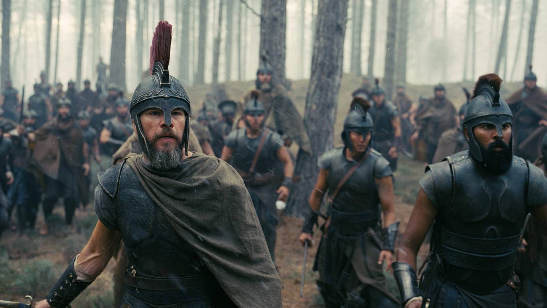 Matt Damon as Odysseus and Himesh Patel as Eurylochus in armour in The Odyssey