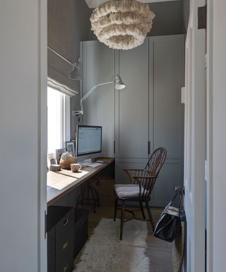 home office space with desk and wooden chair