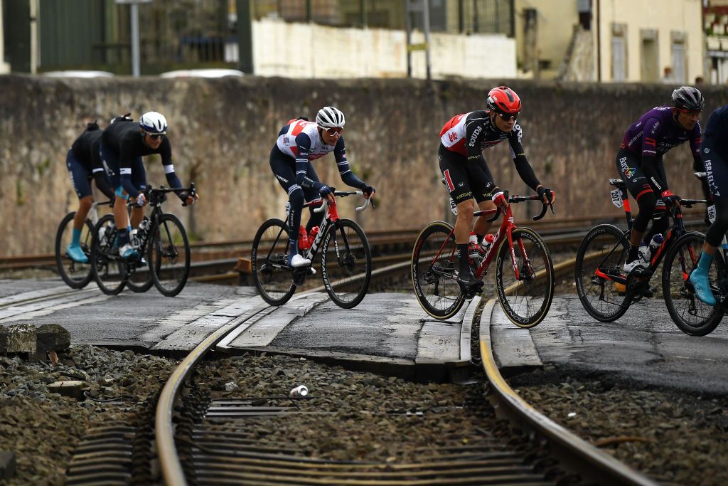The Itzulia Basque Country peloton ride carefully on a level crossing