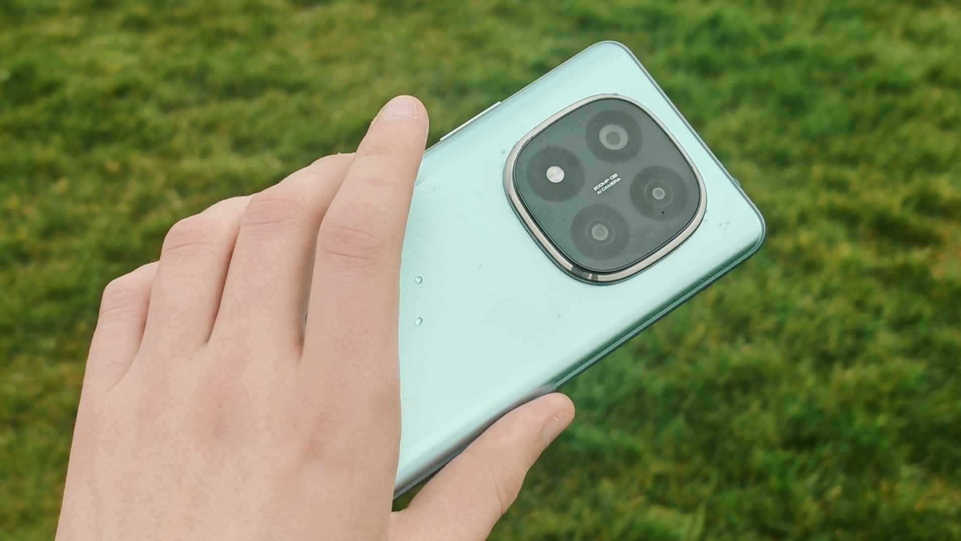 Xiaomi Redmi Note 14 Pro Plus 5G phone in hand and on grass showing homescreens and cameras up close
