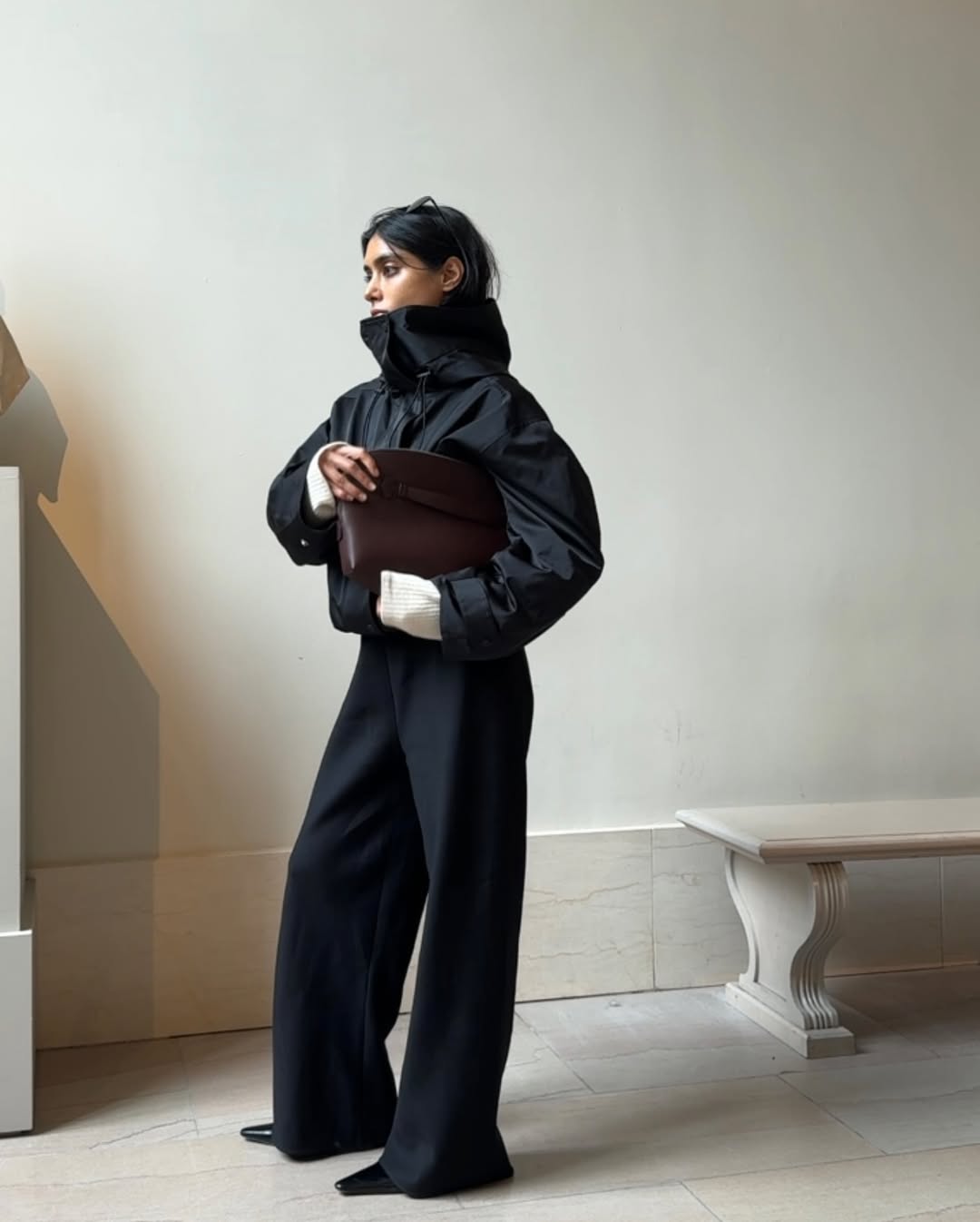 Shay June wearing a funnel-neck jacket in New York