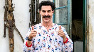 Sacha Baron Cohen giving the thumbs up while wearing Mickey Mouse pajamas in Borat Subsequent Moviefilm.