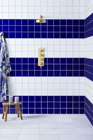A striped blue and white tiled bathroom