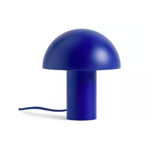 A cobalt blue mushroom-shaped lamp