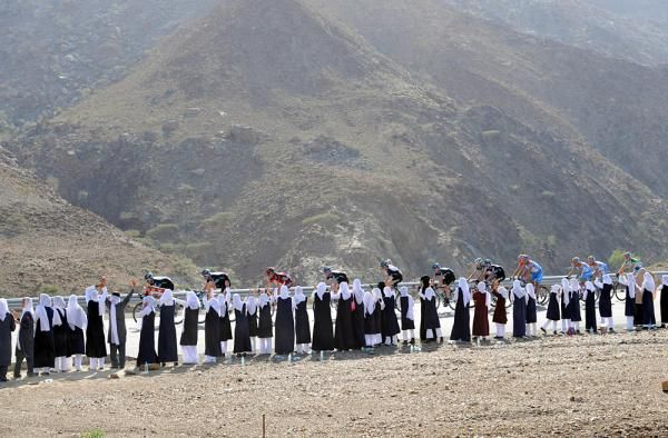 Female fans catch a glimpse of Team Sky punishing the peloton