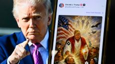 TOPSHOT - This photo illustration created on April 13, 2026 shows a picture of US President Donald Trump on a screen and an AI-generated picture he posted on his Truth Social platform depicting himself as Jesus Christ after criticizing Pope Leo XIV. Trump later posted an AI-generated image seemingly depicting himself as Jesus Christ. In the image, the president appears dressed in red and white robes as he cures a man with his healing hand. The American flag is shown over his shoulder. Trump and the White House have previously shared AI-generated images, including one that showed the president dressed as the pope. (Photo by Mandel NGAN / AFP via Getty Images)