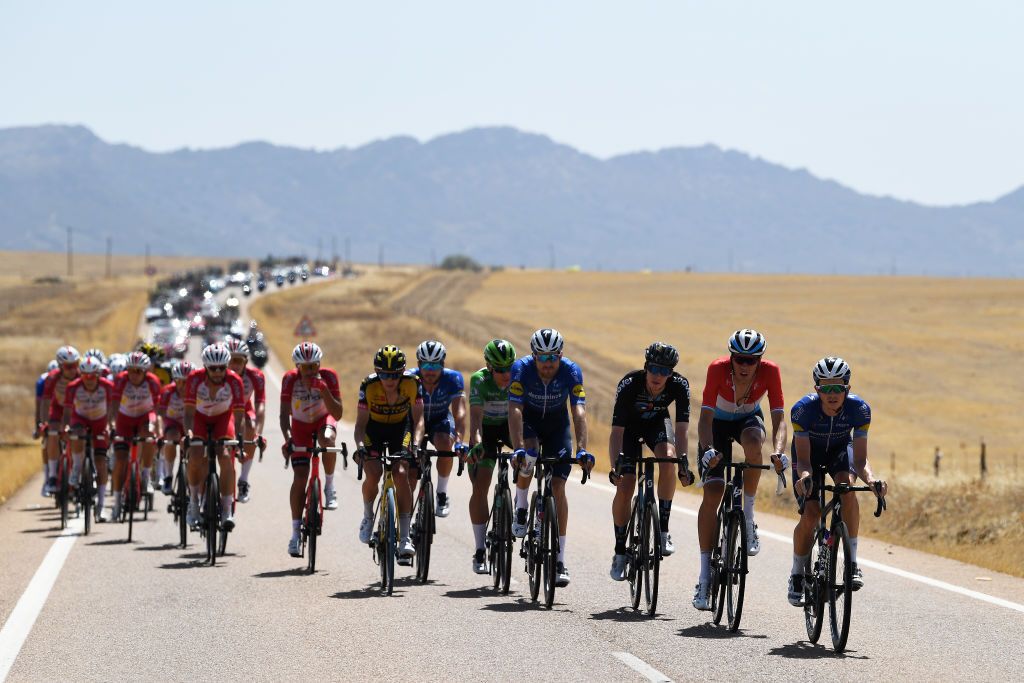 VILLANUEVA DE LA SERENA SPAIN AUGUST 27 LR Fabio Jakobsen of Netherlands and Team Deceuninck QuickStep green points jersey Bert Van Lerberghe of Belgium and Team Deceuninck QuickStep Martijn Tusveld of the Netherlands and Team DSM Kevin Geniets of Luxembourg and Team Groupama FDJ and James Knox of United Kingdom and Team Deceuninck QuickStep lead the peloton during the 76th Tour of Spain 2021 Stage 13 a 2037km stage from Belmez to Villanueva de la Serena lavuelta LaVuelta21 on August 27 2021 in Villanueva de la Serena Spain Photo by Tim de WaeleGetty Images
