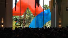 Attendees fill the hall at Google Cloud Next 2026, with the logo visible in large print on a window looking out on the Mandalay Bay Resort beach area.