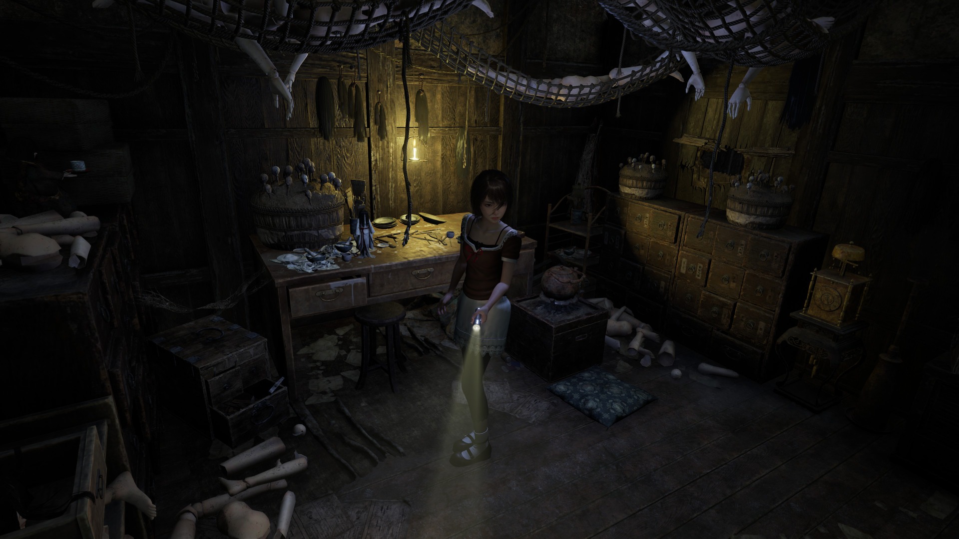 Mio looks around a room covered in doll parts