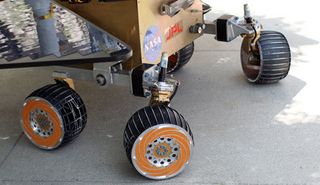The rover can rotate in place by turning the end wheels in opposite directions.