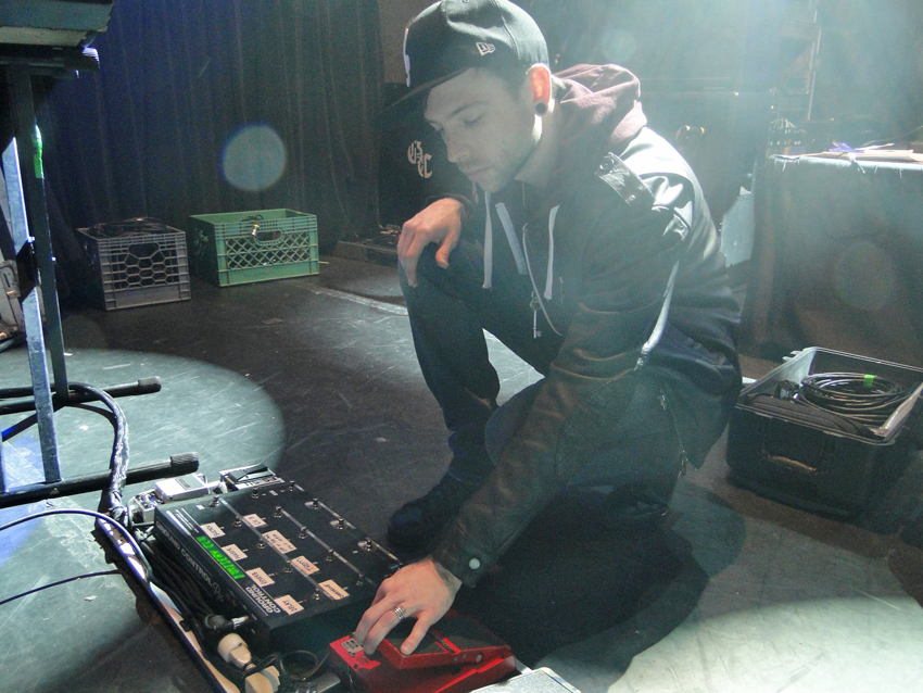 Pre-soundcheck, Billy Martin tweaks his pedalboard