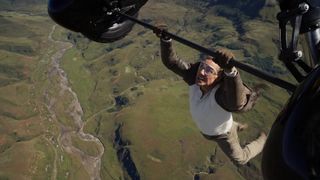 Tom Cruise hangs from a plane in Mission: Impossible - The Final Reckoning