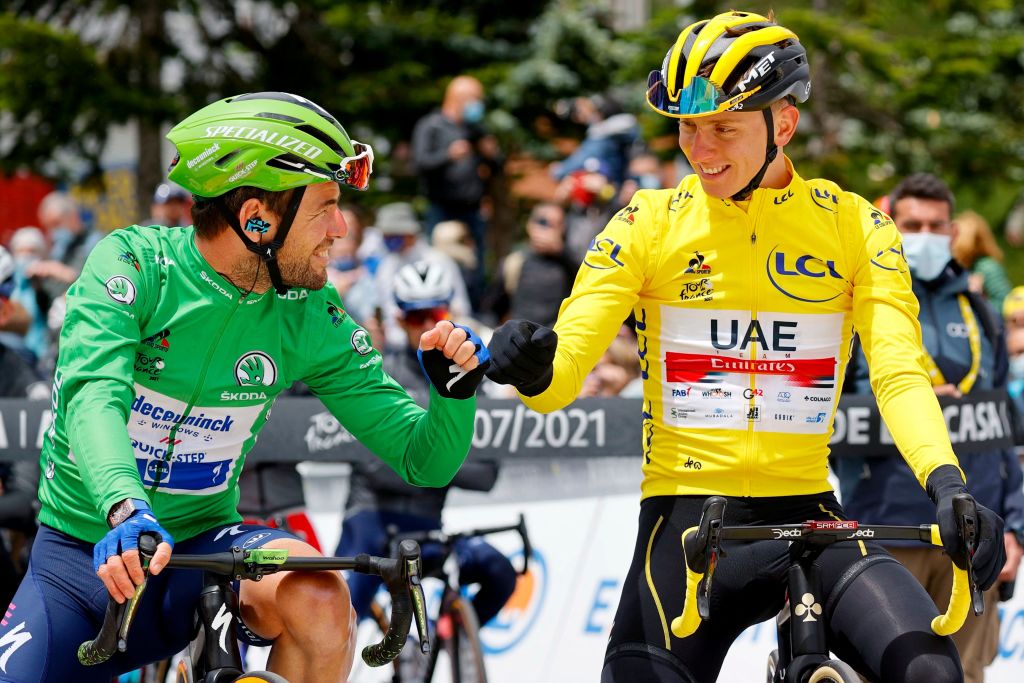 Team UAE Emirates Tadej Pogacar of Slovenia wearing the overall leaders yellow jersey R fist bumps with Team Deceuninck Quicksteps Mark Cavendish of Great Britain wearing the best sprinters green jersey prior to the start of 16th stage of the 108th edition of the Tour de France cycling race 169 km between Pas De La Case and SaintGaudens on July 13 2021 Photo by Thomas SAMSON AFP Photo by THOMAS SAMSONAFP via Getty Images