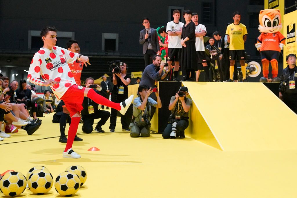 Riders do karate and football-darts before the 2019 Saitama Tour de France criterium