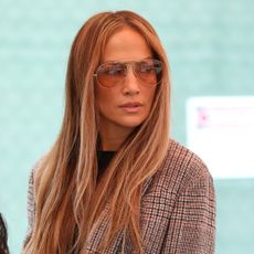 Jennifer Lopez wears a plaid blazer jeans and a rare birkin bag in los angeles