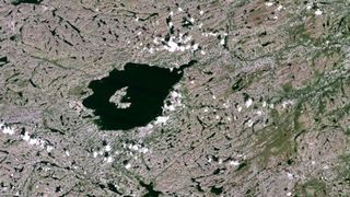 The rock was found within the Mistastin impact crater in Labrador, Canada, shown here in this satellite image.