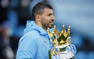 Argentine striker Sergio Aguero holding the Premier League trophy while playing for Manchester City