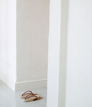 Photo of flip flops and white walls