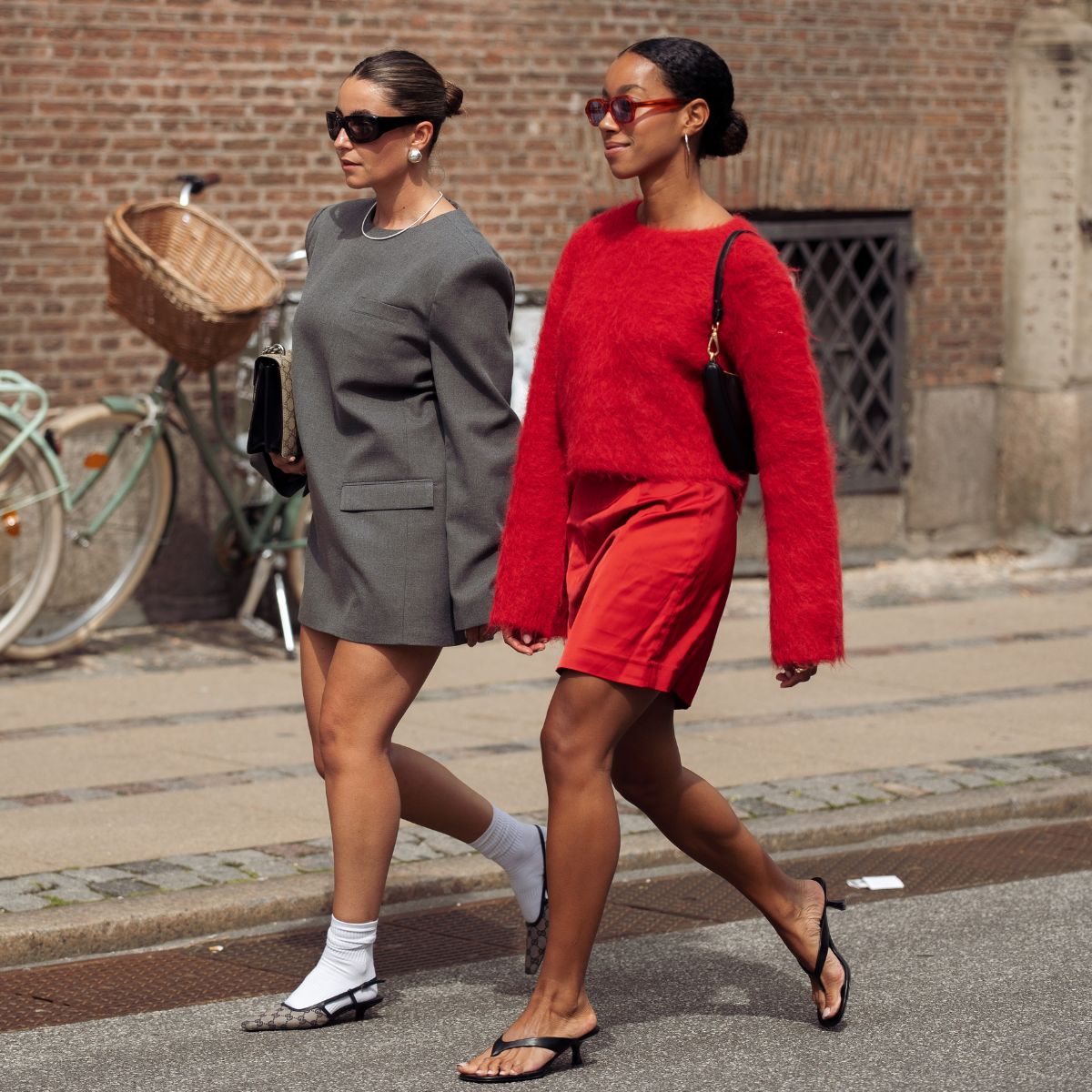street style shot of two women with bronzed skin