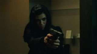 Adrianne Palicki as Ms. Perkins in John Wick