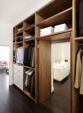 Fitted clothes storage combination from Cue & Co of London