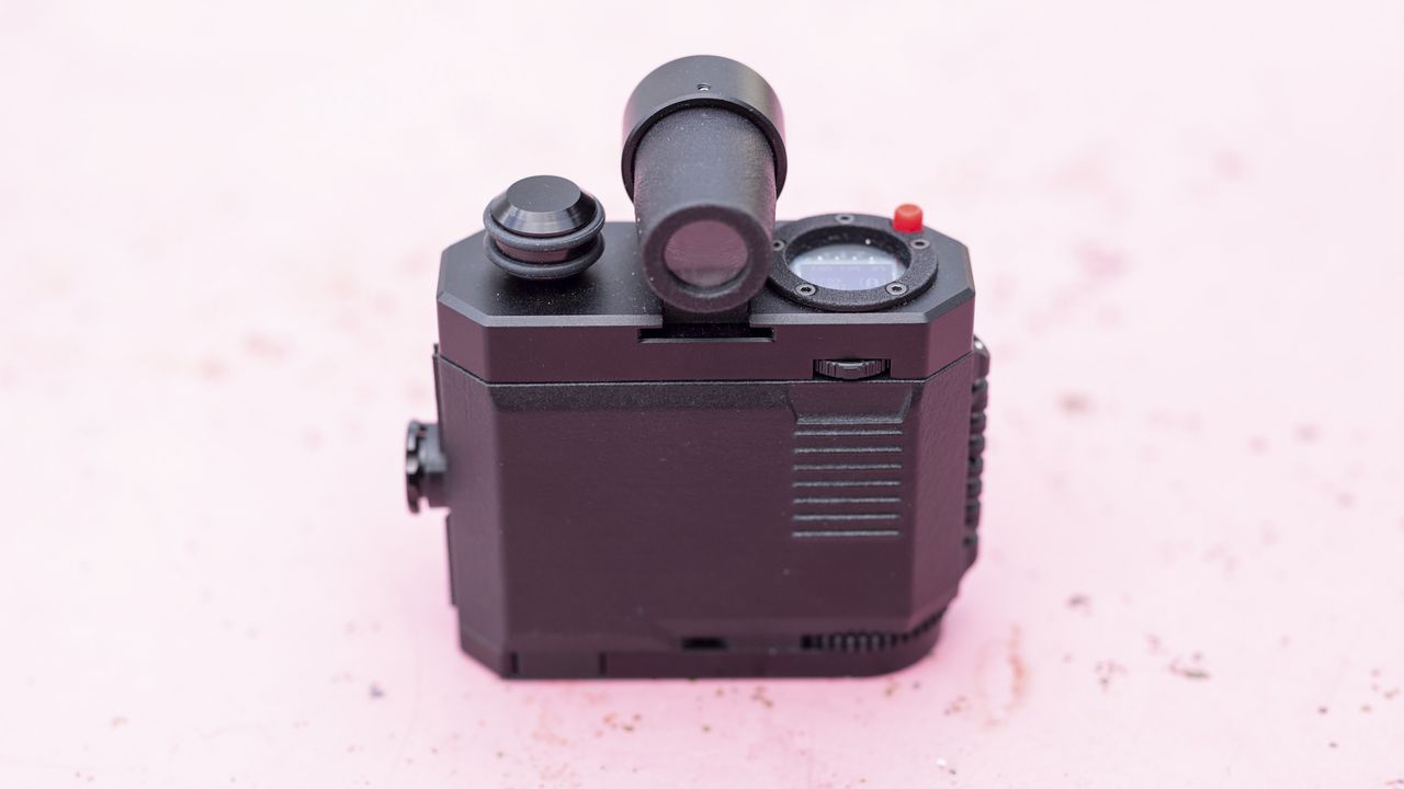 Alfie Tych camera on pink surface
