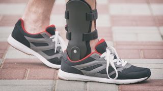 Runner wearing ankle brace
