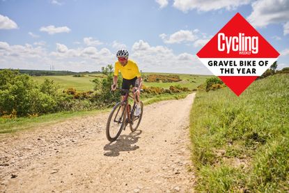 male rider in yellow jersey riding a Giant revolt gravel bike