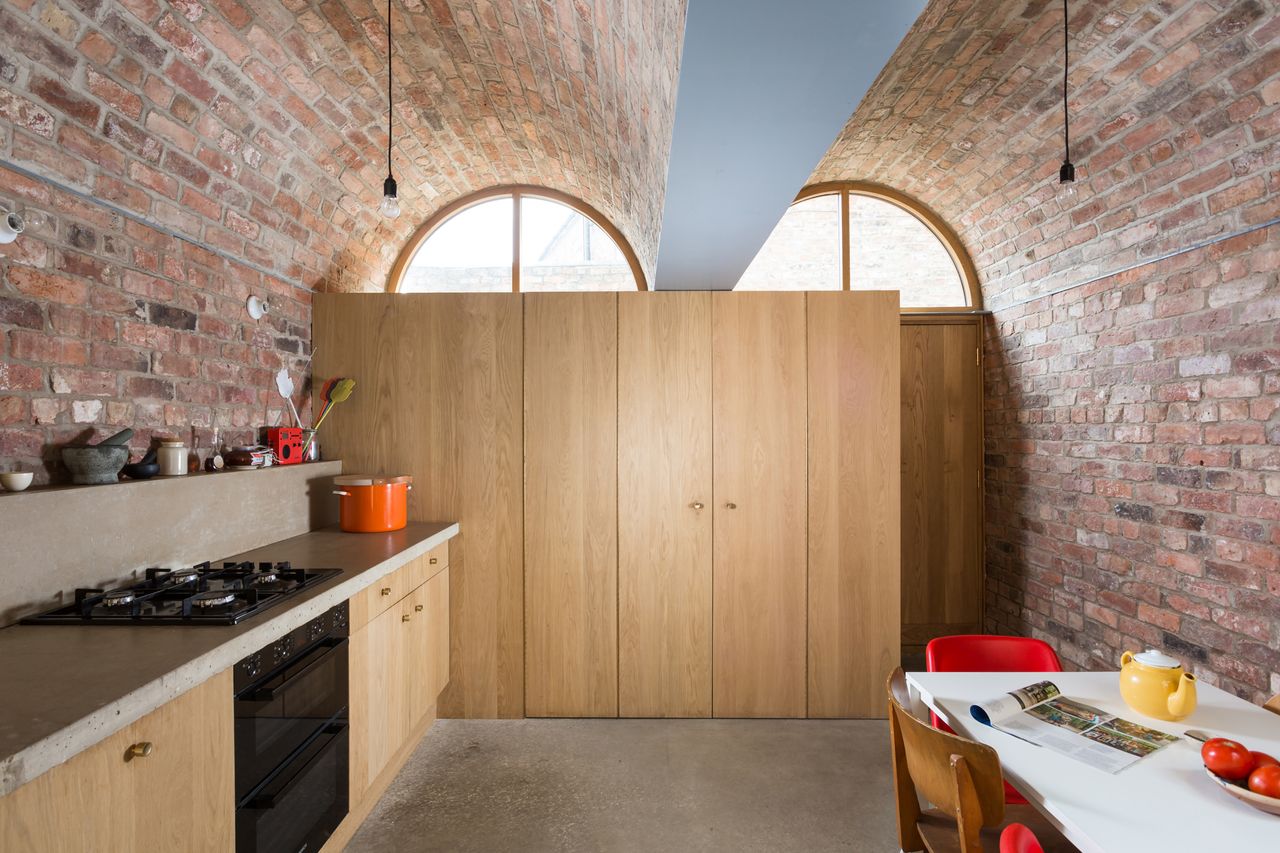 oak kitchen storage in barrel vaulted room