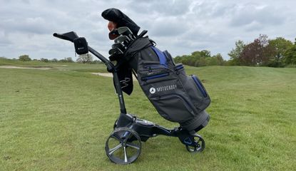 The Motocaddy 2022 Dry Series Cart Bag on a golf trolley