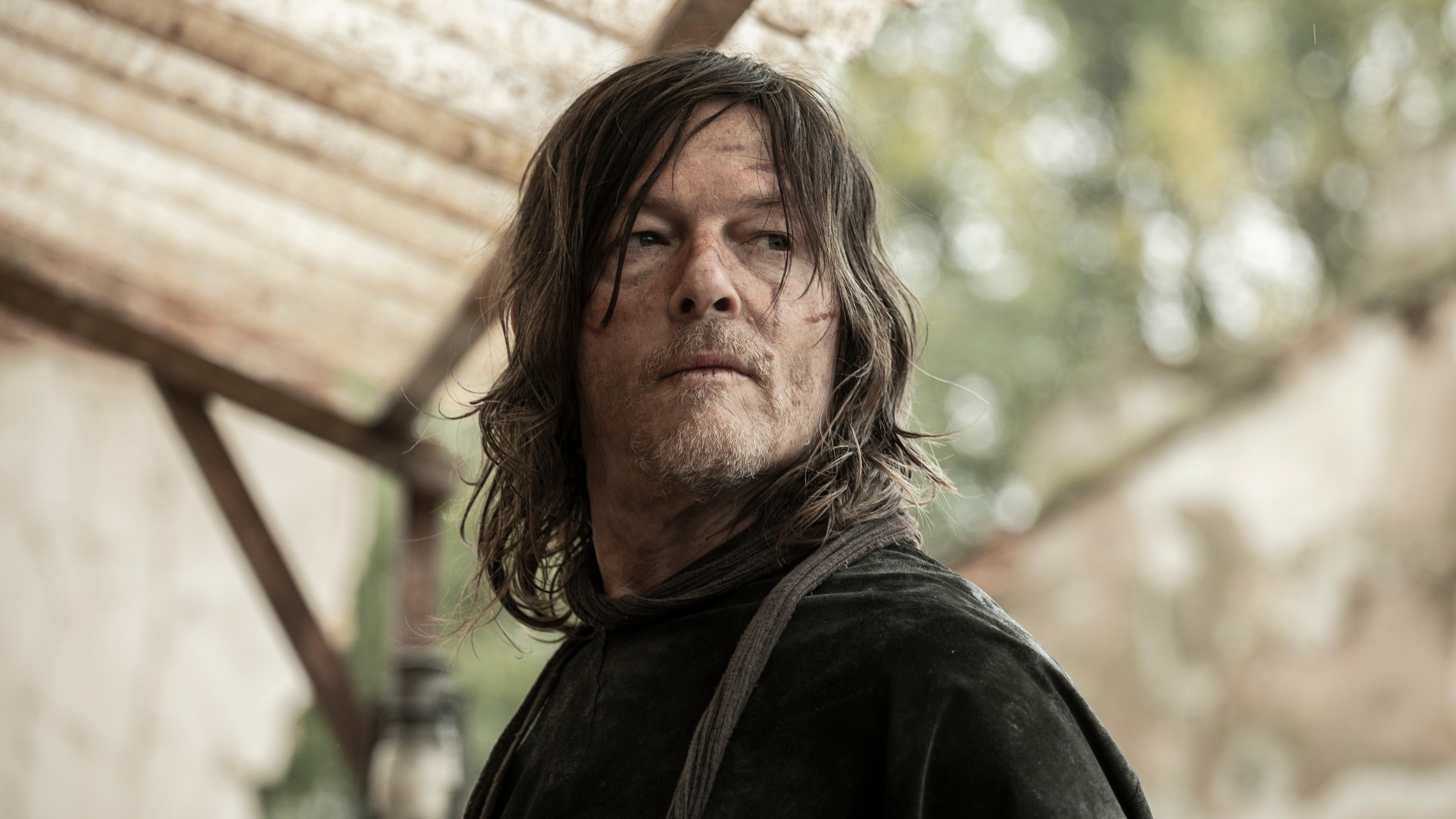 Norman Reedus as Daryl Dixon looking at something off camera.