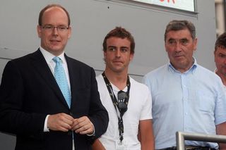 (L-R) Prince Albert of Monaco, F1 driver Fernando Alonso and Belgian cycling legend Eddy Merckx at the start of the Tour in Monaco.