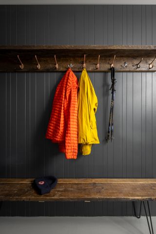wooden clothes hanger on grey wall