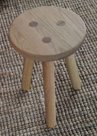 The simple, three-legged stool was created by contemporary oak furniture company Another Country