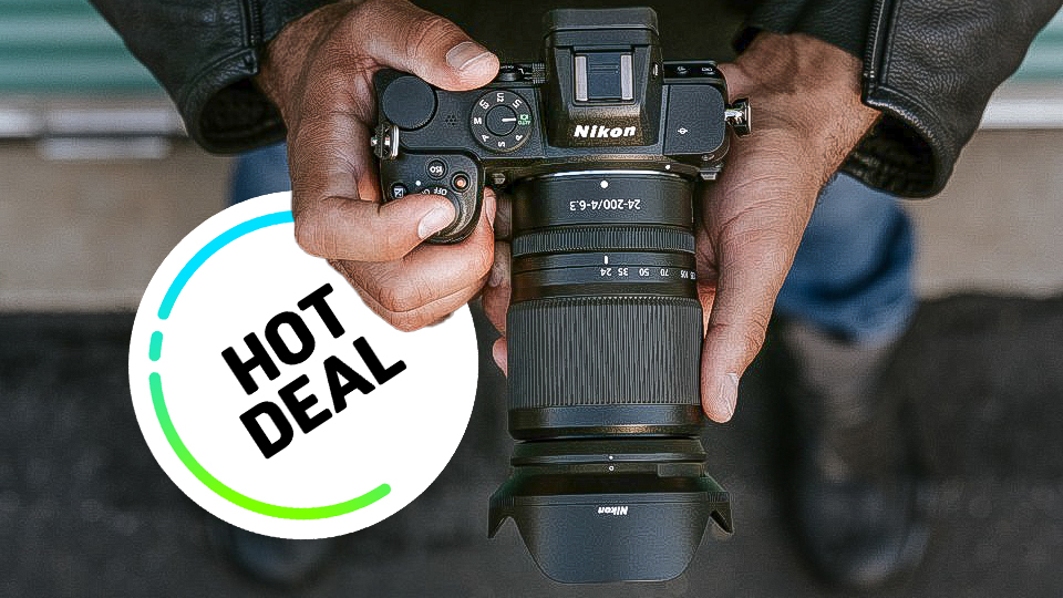 Top-down view of Nikon Z5 and Z 24-200mm lens handheld with a Hot Deal sticker