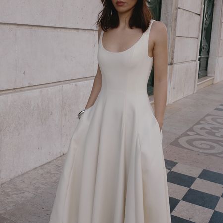 a woman wearing a white dress