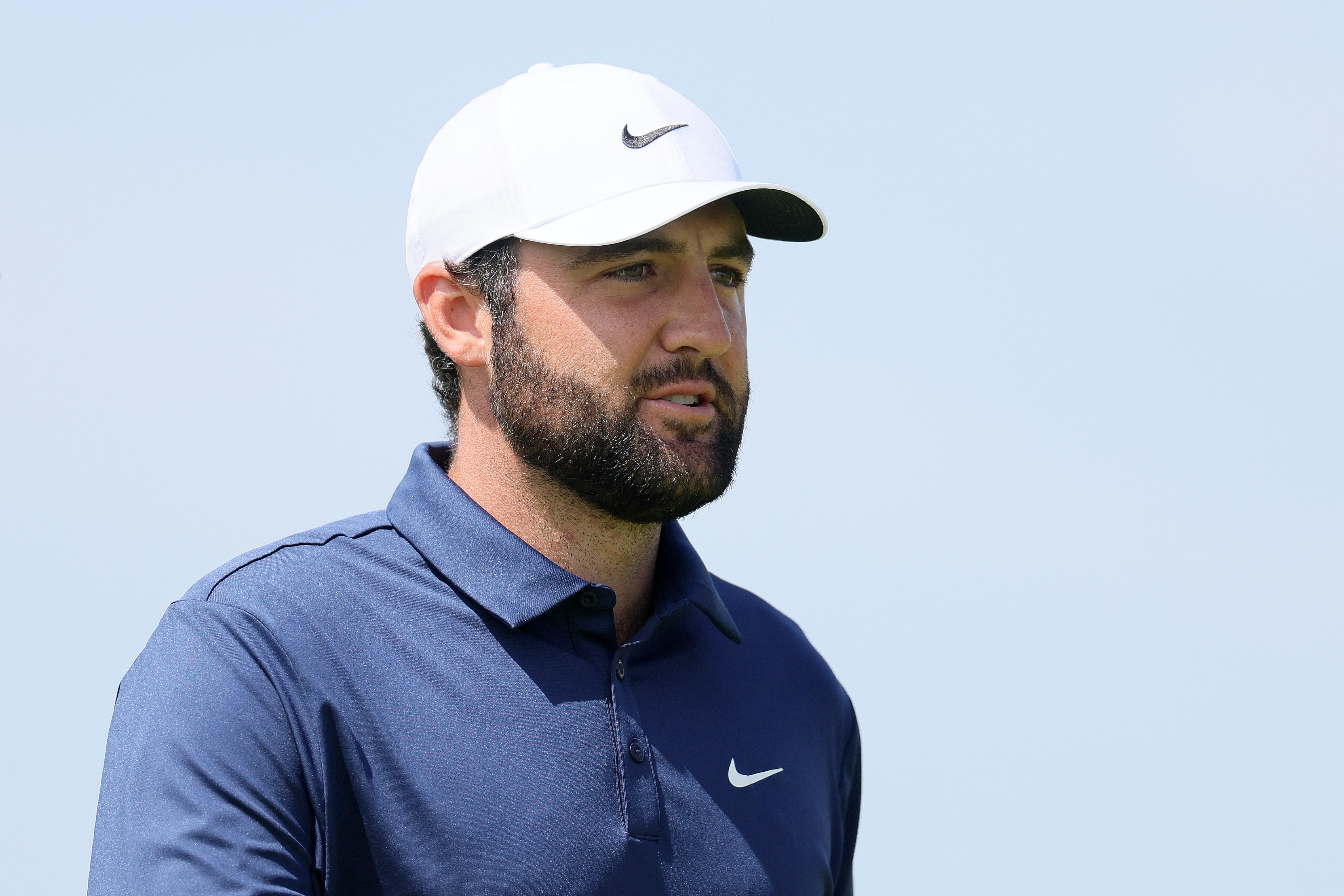 Scottie Scheffler walks off the green