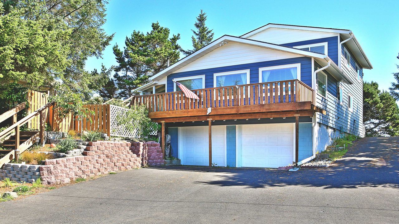 house exterior with large driveway