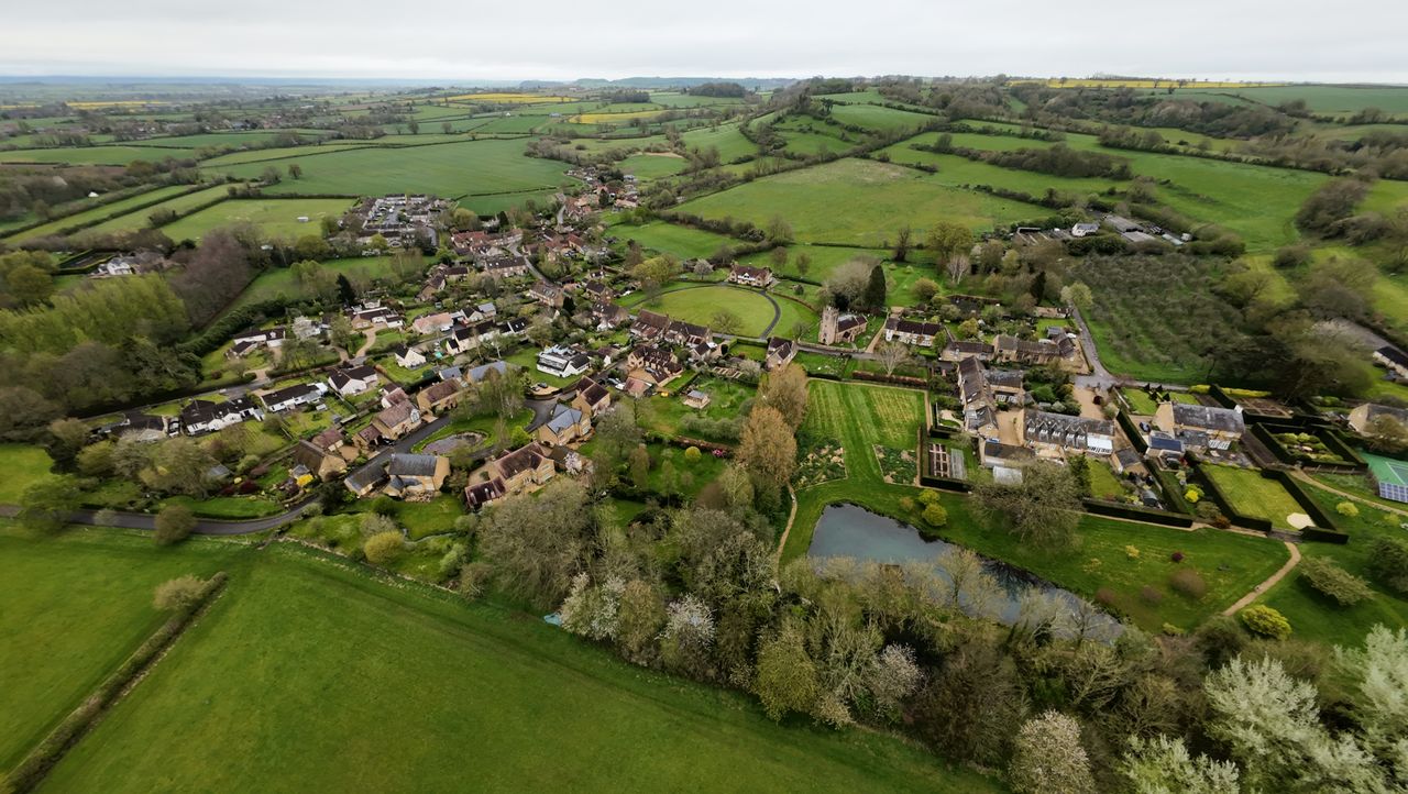 Aerial images of rural UK village and fields on an overcast day taken with the DJI Avata 2