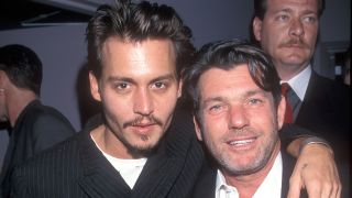 Johnny Depp and Jann Wenner pose for a picture in the nineties