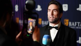 LONDON, ENGLAND - APRIL 08: Leslie Benzies in the winners room during the BAFTA Games Awards 2025 at the Queen Elizabeth Hall on April 08, 2025 in London, England. (Photo by Dan Fearon/BAFTA via Getty Images)