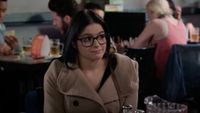 Ariel Winter sitting at a table on Modern Family